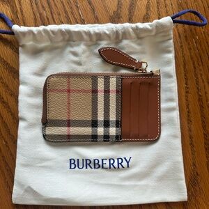 Burberry Cream and Black Canvas Pouch 

Only used once.